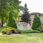 The stone marker sign outside of Forest Park