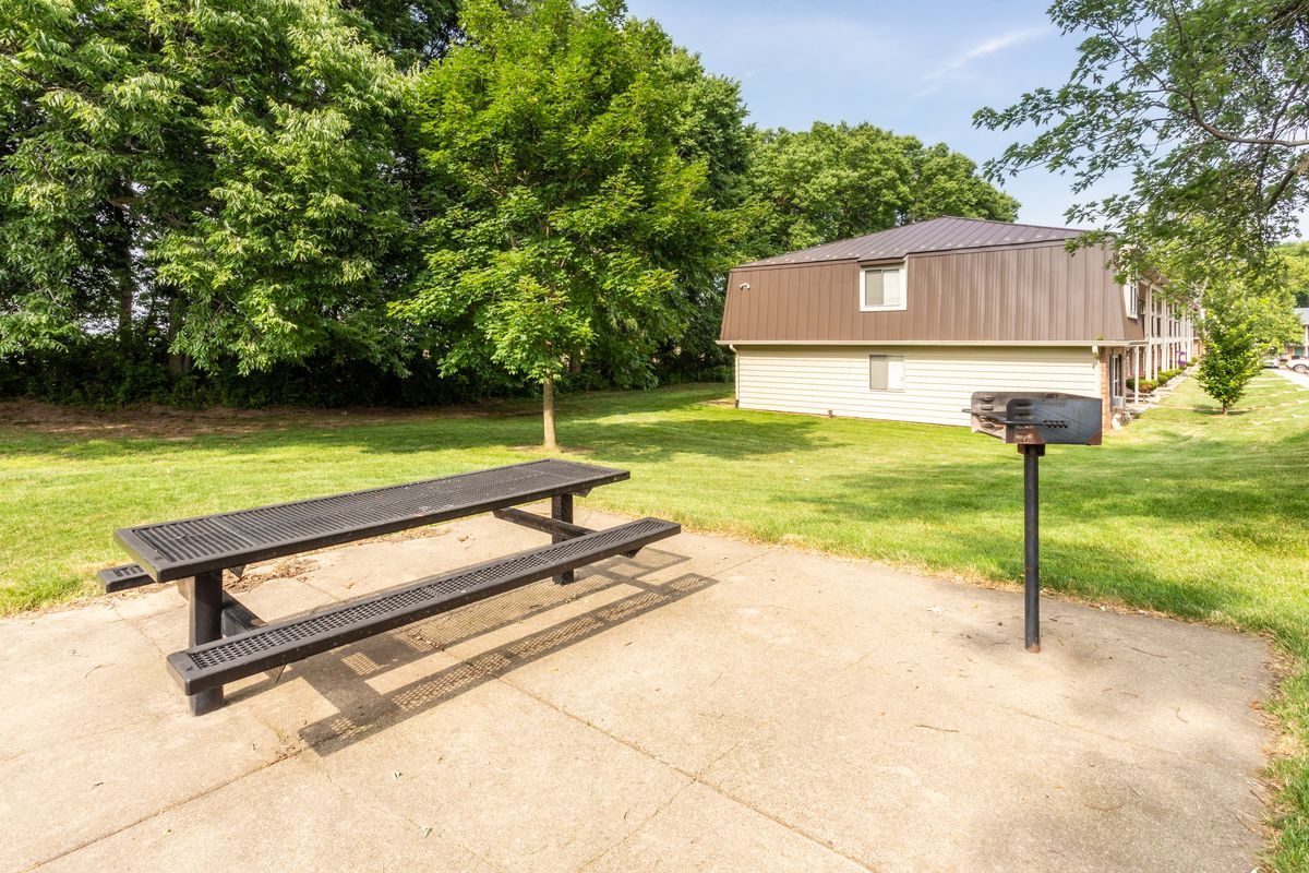 An outdoor picnic and grilling location on the Forest Park grounds